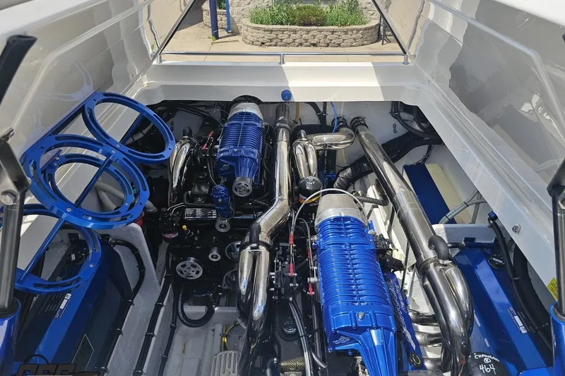 Slide: The Image of 2007 Fountain 42 Lightning engine compartment with blue accents and polished components. - 92