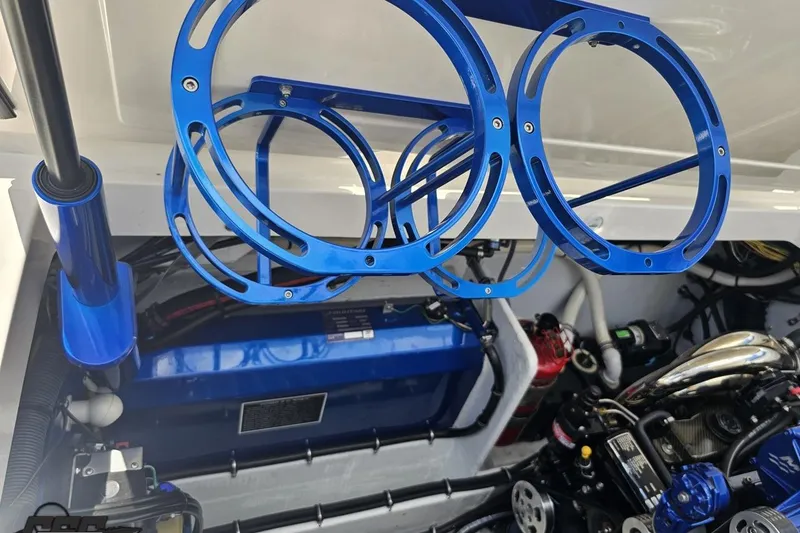 Slide: The Image of Engine compartment of 2007 Fountain 42 Lightning boat with blue accents and components. - 94
