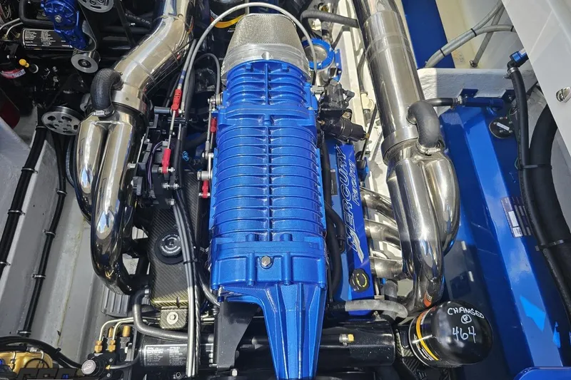 Slide: The Image of Engine of a 2007 Fountain 42 Lightning boat, featuring a blue Mercury Racing component. - 95