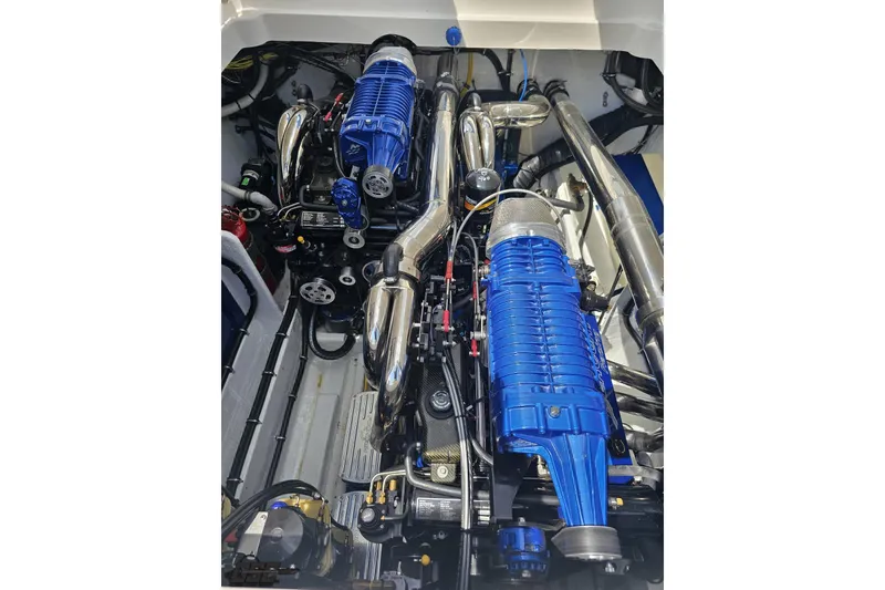 Slide: The Image of Engine compartment of a 2007 Fountain 42 Lightning boat with dual blue superchargers. - 97