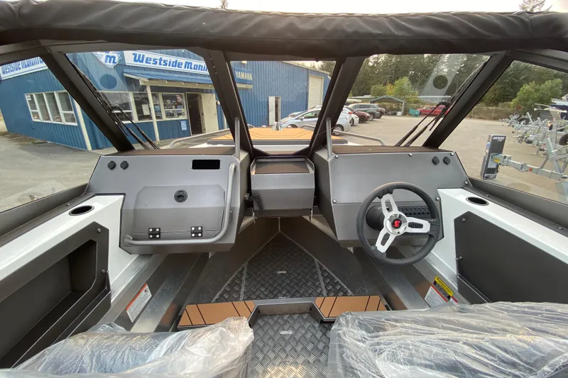 Slide: The Image of 2026 Stabicraft 2050 Trekker boat interior with modern dashboard and steering wheel. - 6