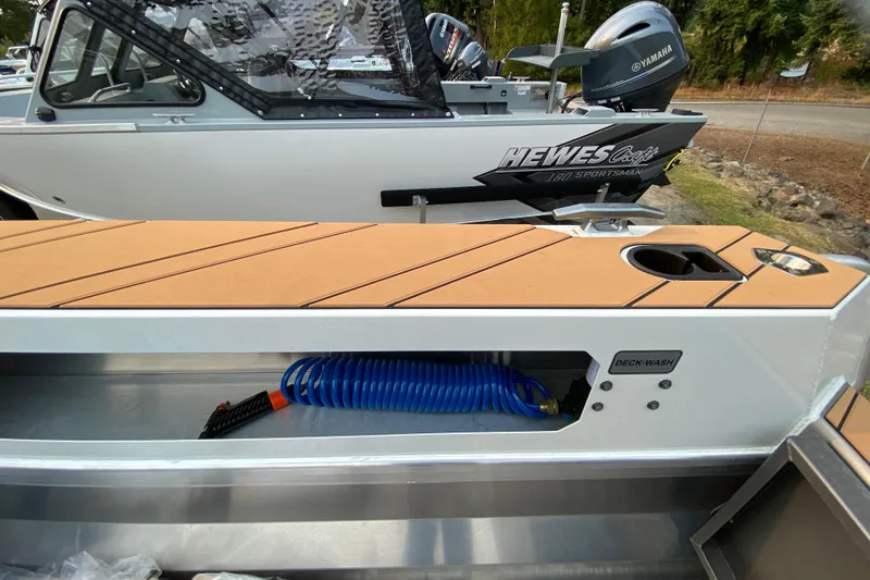 Slide: The Image of 2026 Stabicraft 2050 Trekker boat with deck wash feature and coiled hose. - 7