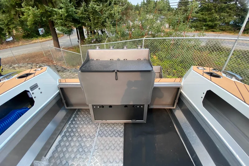 Slide: The Image of Stabicraft 2050 Trekker 2026 boat interior with storage compartments and aluminum flooring. - 8