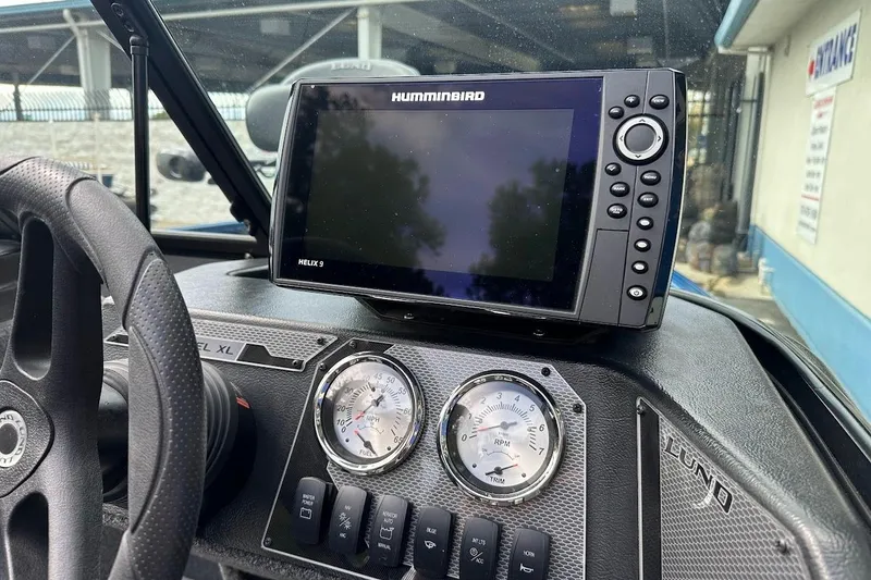 Slide: The Image of 2024 Lund 1650 Rebel XL Sport dashboard with Humminbird Helix 9 fish finder. - 21