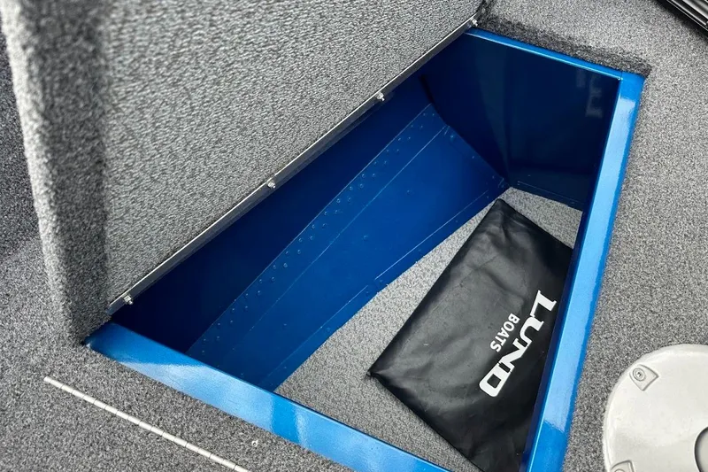 Slide: The Image of 2024 Lund 1650 Rebel XL Sport storage compartment with Lund Boats bag. - 32
