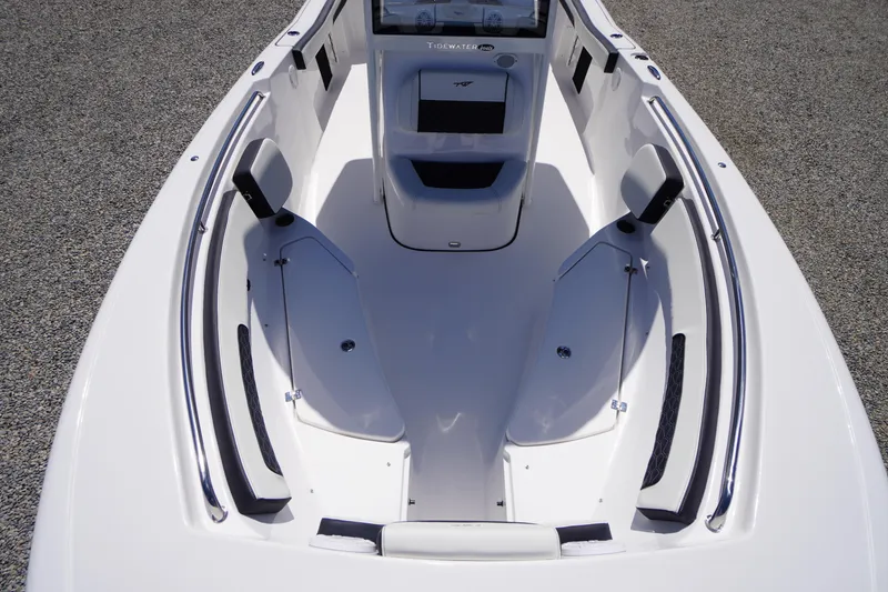 Slide: The Image of 2026 Tidewater 220 CC Adventure boat interior with seating and storage compartments. - 10