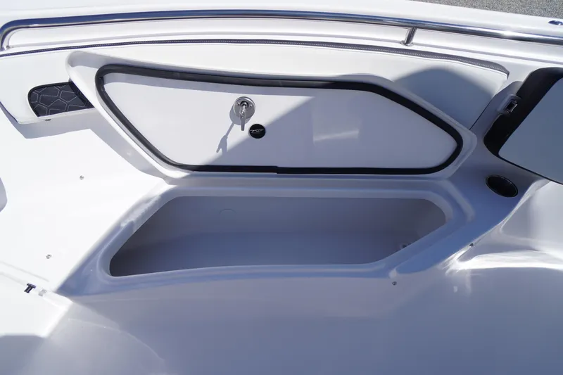 Slide: The Image of 2026 Tidewater 220 CC Adventure boat storage compartment with sleek design and secure lock. - 12