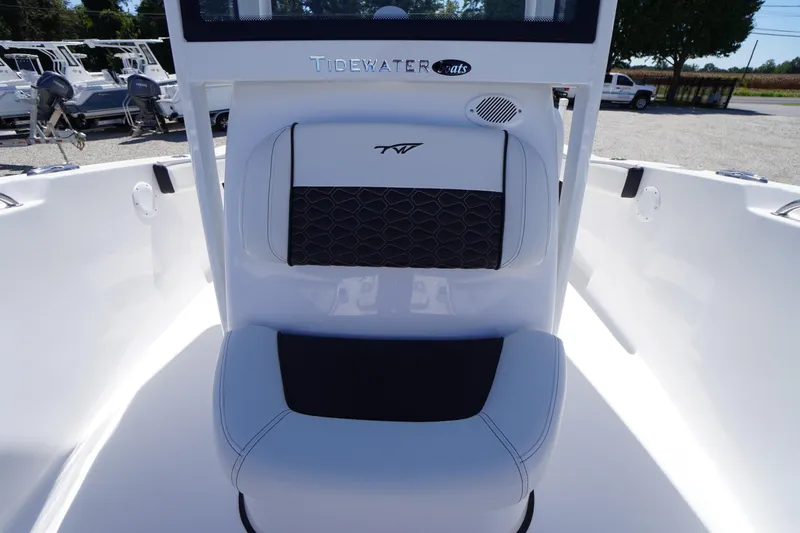 Slide: The Image of 2026 Tidewater 220 CC Adventure boat interior with cushioned seating and sleek design. - 14