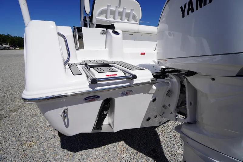 Slide: The Image of 2026 Tidewater 220 CC Adventure boat with Yamaha engine, rear view. - 18