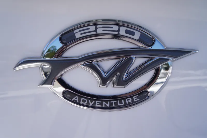 Slide: The Image of 2026 Tidewater 220 CC Adventure emblem on boat exterior. - 2