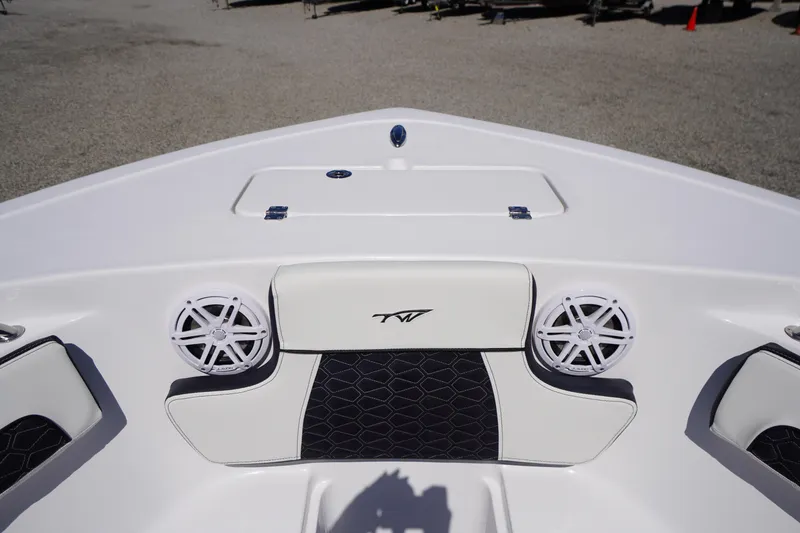 Slide: The Image of 2026 Tidewater 220 CC Adventure boat interior with speakers and seating. - 3