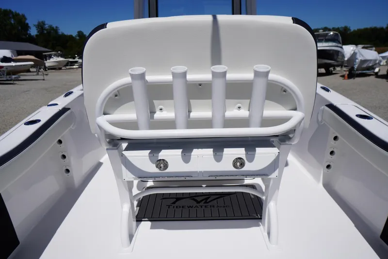 Slide: The Image of 2026 Tidewater 220 CC Adventure boat interior with rod holders and storage. - 38