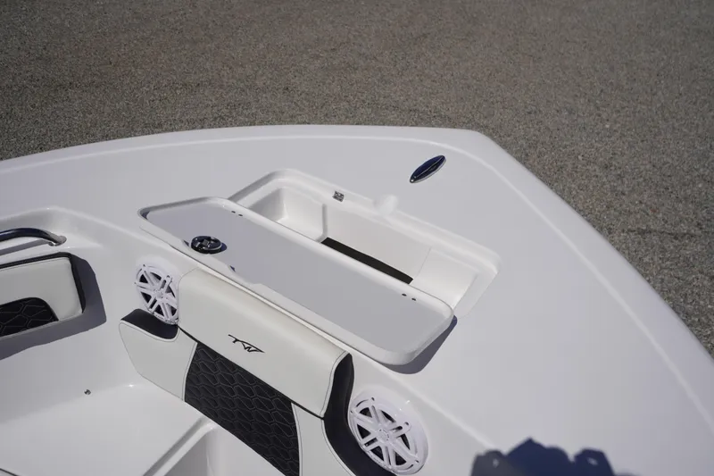 Slide: The Image of 2026 Tidewater 220 CC Adventure boat interior with seating and storage compartments. - 4