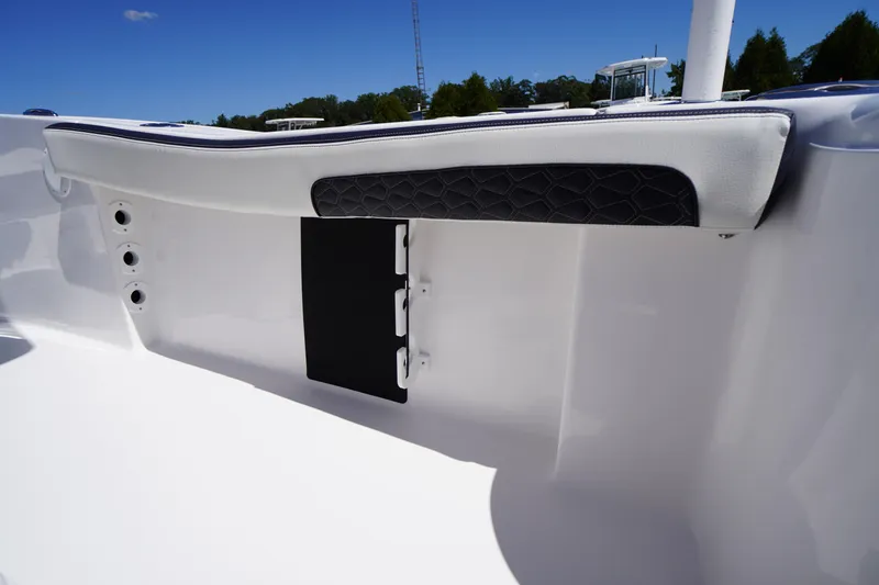 Slide: The Image of 2026 Tidewater 220 CC Adventure boat interior detail with cushioned seating and sleek design. - 40
