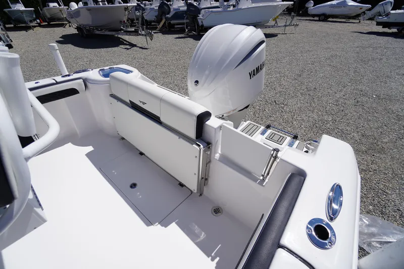 Slide: The Image of 2026 Tidewater 220 CC Adventure boat with Yamaha engine, rear seating, and sleek design. - 43