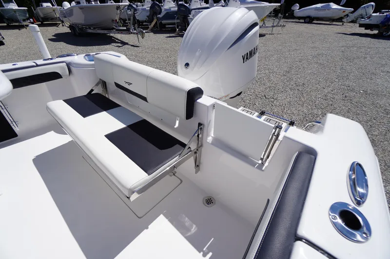 Slide: The Image of 2026 Tidewater 220 CC Adventure boat interior with Yamaha engine, featuring sleek seating and modern design. - 46