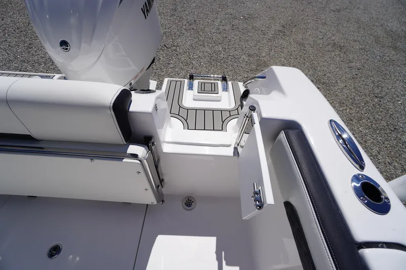 Slide: The Image of 2026 Tidewater 220 CC Adventure boat interior with Yamaha engine, featuring sleek seating and deck design. - 47
