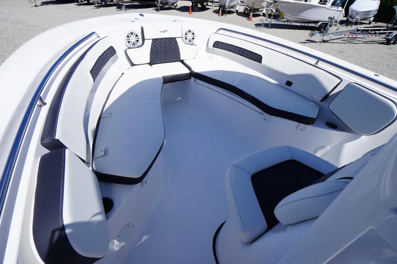Slide: The Image of 2026 Tidewater 220 CC Adventure boat interior with cushioned seating and speakers. - 5