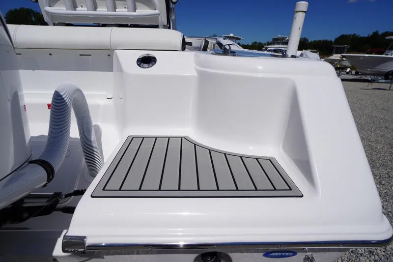 Slide: The Image of 2026 Tidewater 220 CC Adventure boat deck with sleek design and modern features. - 50