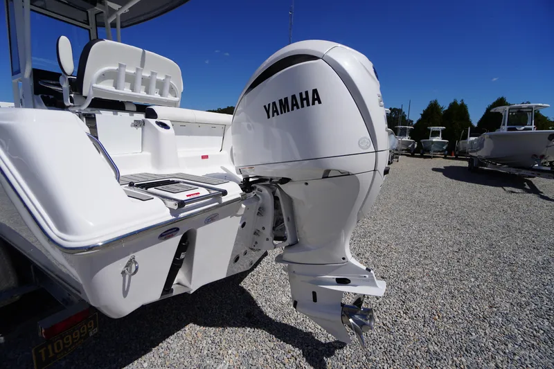 Slide: The Image of 2026 Tidewater 220 CC Adventure boat with Yamaha outboard motor on gravel lot. - 52