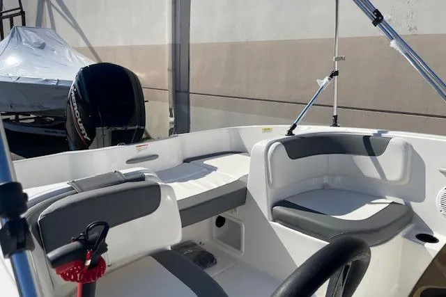 Slide: The Image of 2026 Bayliner Element E16 boat interior with seating and steering wheel. - 8