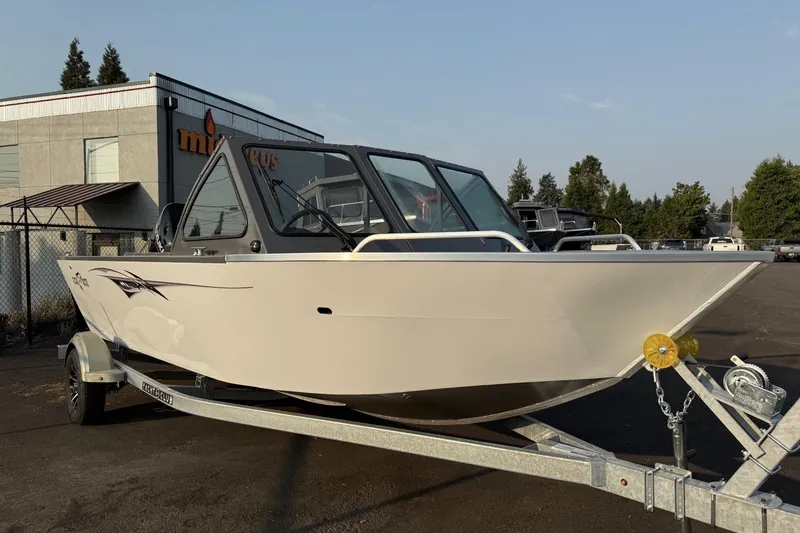 The Image of 2026 Fish Rite Sportsman 20 boat on trailer, parked outdoors. - 0
