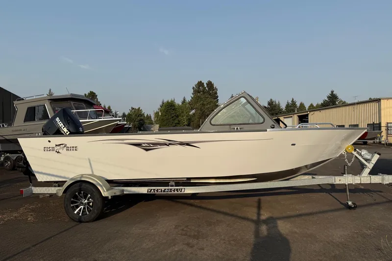 Slide: The Image of 2026 Fish Rite Sportsman 20 boat with Suzuki outboard motor on a trailer. - 1