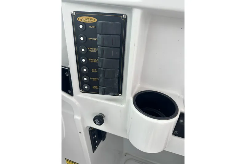 Slide: The Image of Control panel of 2005 Glacier Bay 2680 Coastal Runner boat with cup holder. - 19