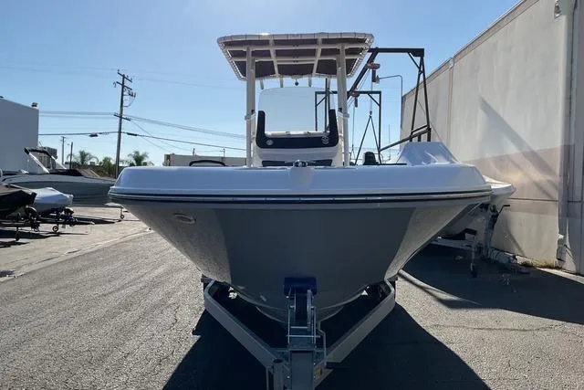 Slide: The Image of 2026 Bayliner Trophy T22CC boat deck with motor and rod holders. - 14