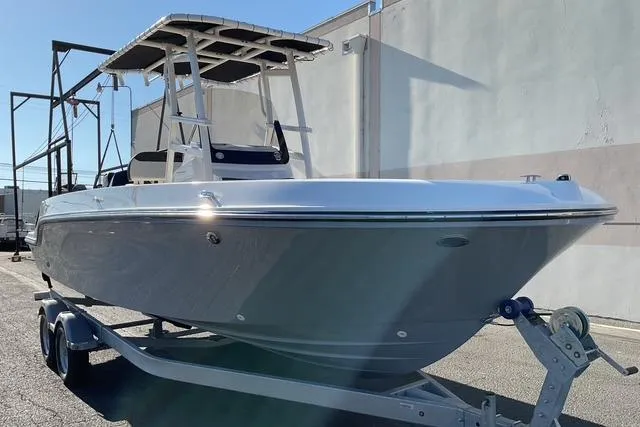 Slide: The Image of Interior view of 2026 Bayliner Trophy T22CC boat, featuring seating and storage compartment. - 15