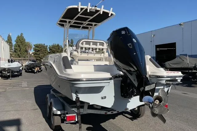 Slide: The Image of 2026 Bayliner Trophy T22CC storage compartment, open hatch, spacious interior view. - 16