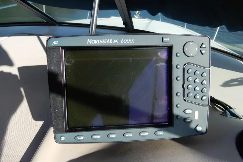 Slide: The Image of Northstar 6000i navigation system on 2004 Sea Ray 280 Sundancer boat dashboard. - 18