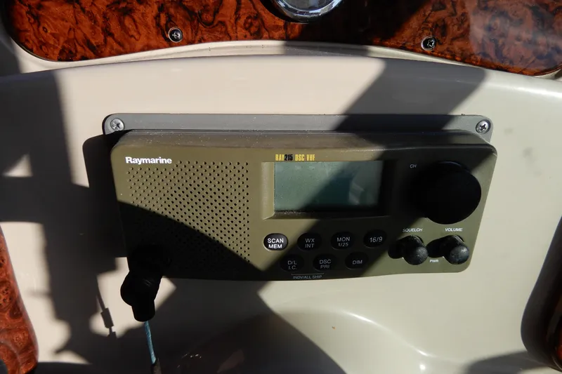 Slide: The Image of Raymarine radio on 2004 Sea Ray 280 Sundancer boat dashboard. - 19