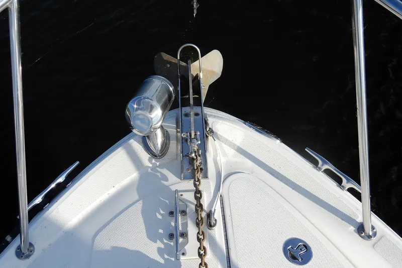Slide: The Image of Bow of 2004 Sea Ray 280 Sundancer with anchor and chain mechanism. - 20