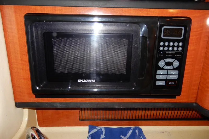 Slide: The Image of Sylvania microwave in 2004 Sea Ray 280 Sundancer boat kitchen. - 29