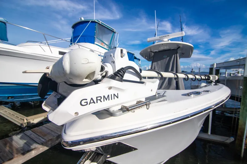 Slide: The Image of 2023 Cobia 280 Center Console with Garmin equipment at marina. - 21