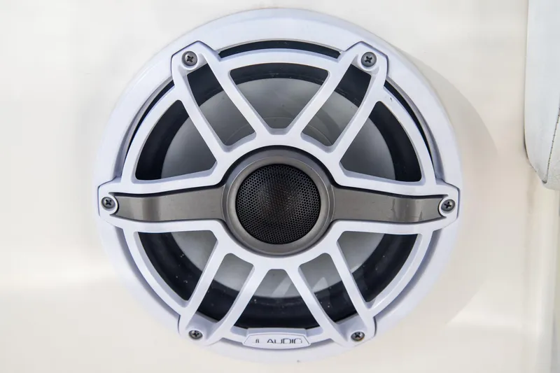 Slide: The Image of Close-up of a marine speaker on a 2023 Cobia 280 Center Console boat. - 26