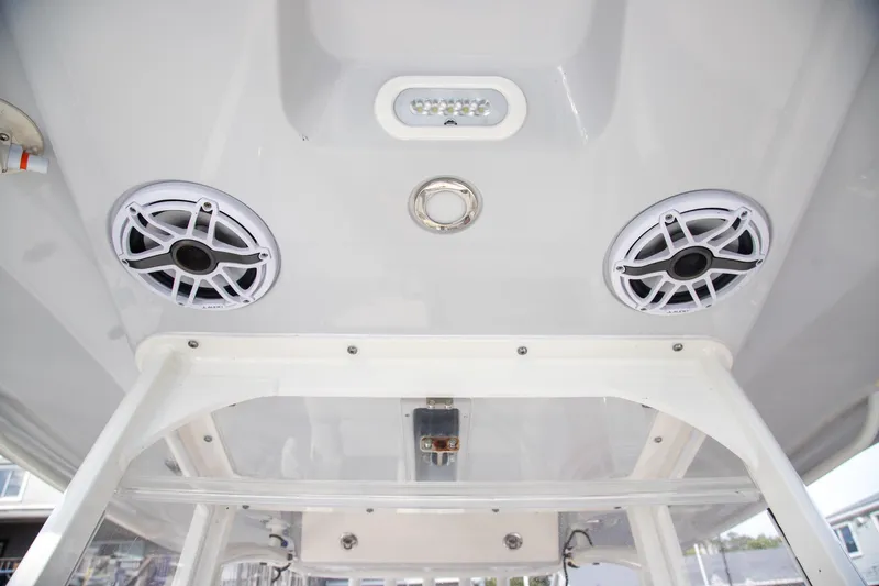 Slide: The Image of 2023 Cobia 280 Center Console boat speakers and lighting detail. - 27