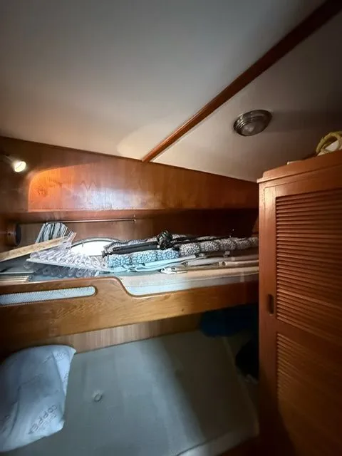 Slide: The Image of Cozy wooden cabin interior with bunk bed and storage, warm lighting. - 11