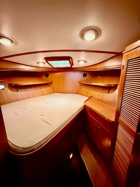 Slide: The Image of Cozy wooden cabin interior with bed, shelves, and ceiling lights. - 9