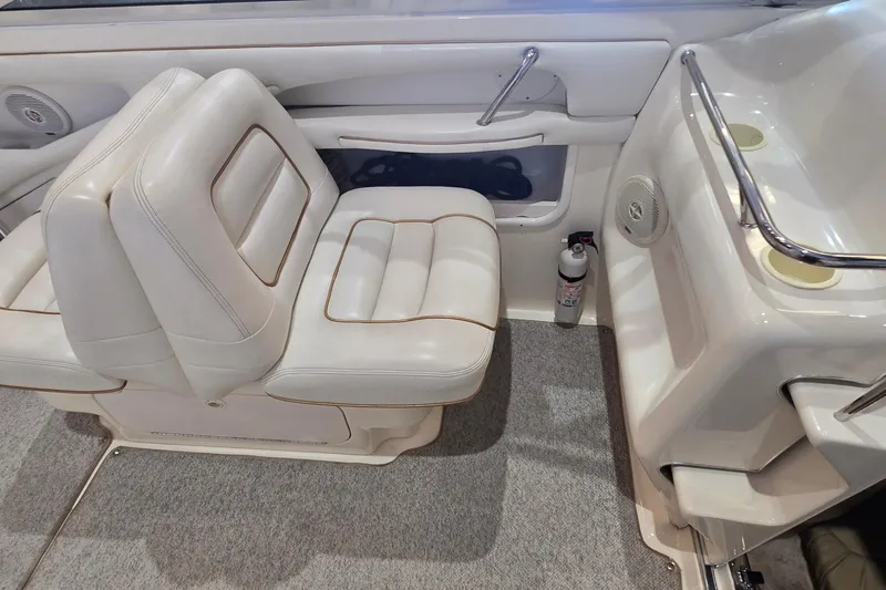 Slide: The Image of 1998 Sea Ray 280 Sun Sport interior with white seating and safety equipment. - 17