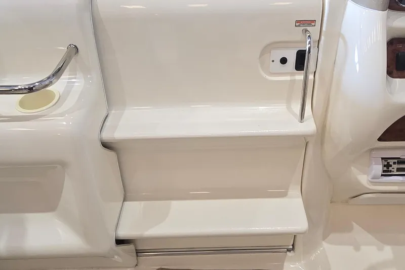 Slide: The Image of Steps and railing on a 1998 Sea Ray 280 Sun Sport boat interior. - 18