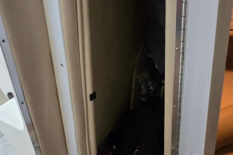 Slide: The Image of Interior storage compartment of a 1998 Sea Ray 280 Sun Sport boat. - 30