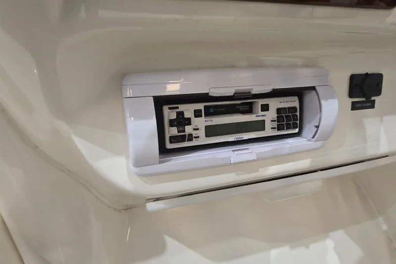 Slide: The Image of 1998 Sea Ray 280 Sun Sport boat stereo system with Clarion marine radio. - 31