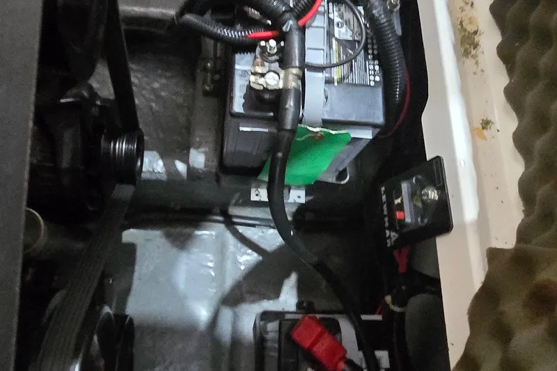 Slide: The Image of Engine compartment of a 1998 Sea Ray 280 Sun Sport boat showing battery and wiring. - 43