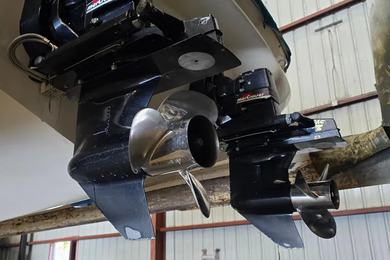 Slide: The Image of 1998 Sea Ray 280 Sun Sport boat with dual MerCruiser outdrives in a storage facility. - 47