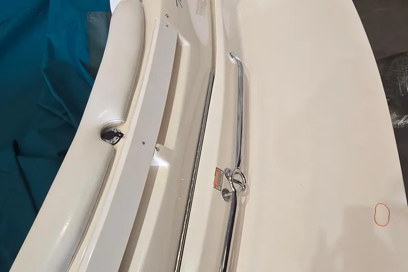 Slide: The Image of 1998 Sea Ray 280 Sun Sport boat deck with chrome railing and white surface. - 9