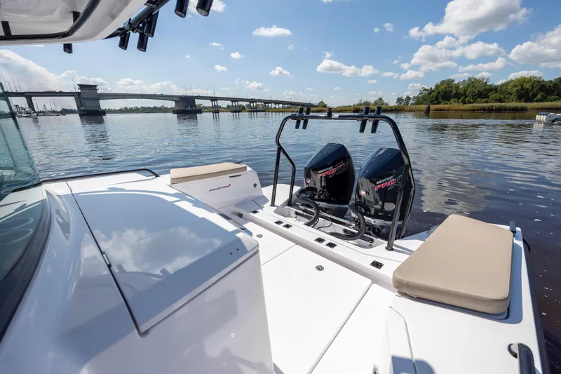 Slide: The Image of 2024 Axopar 37 XC boat with twin Mercury engines on a calm river. - 35