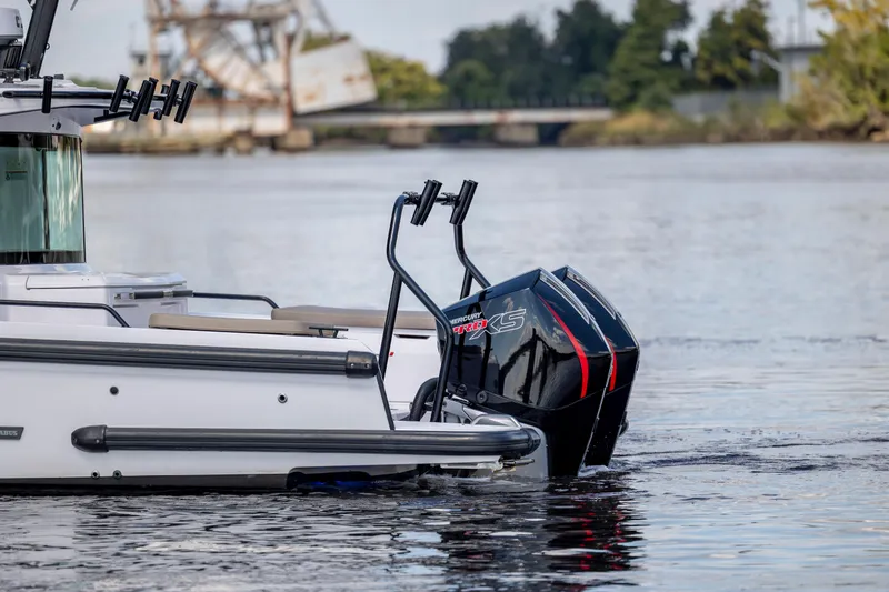 Slide: The Image of 2024 Axopar 37 XC boat with Mercury Pro XS engines on a calm river. - 36