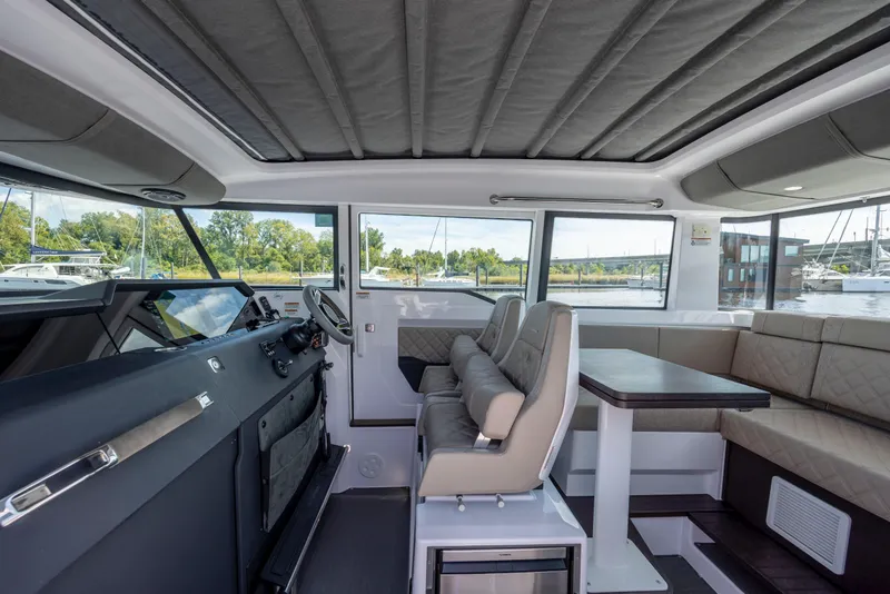 Slide: The Image of Interior of 2024 Axopar 37 XC boat with modern seating and helm. - 56